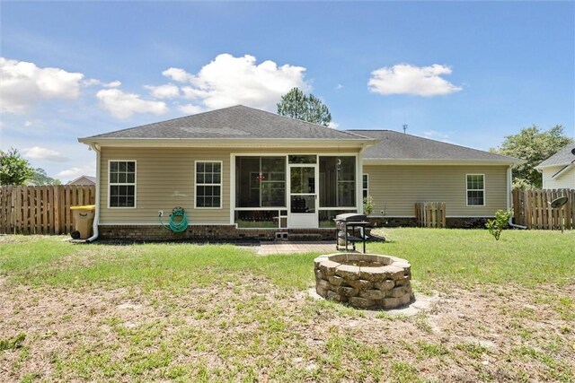 133 Cobbleton Dr, Rincon, GA 31326 - back of house featuring a fire pit, a sunroom, and roof with shingles
