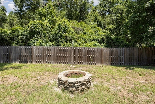 133 Cobbleton Dr, Rincon, GA 31326 - view of yard with an outdoor fire pit