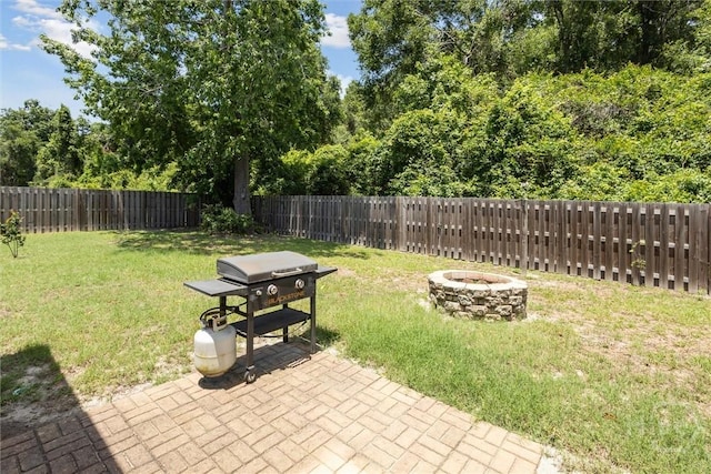 133 Cobbleton Dr, Rincon, GA 31326 - view of yard with an outdoor fire pit and a patio