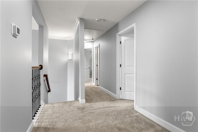 42 Kinlock Ct, Midway, GA 31320 - hallway featuring attic access, an upstairs landing, carpet, and baseboards