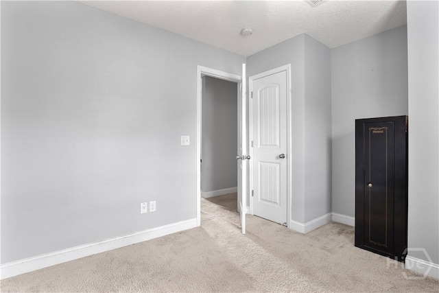 42 Kinlock Ct, Midway, GA 31320 - unfurnished bedroom featuring carpet flooring, baseboards, and a textured ceiling