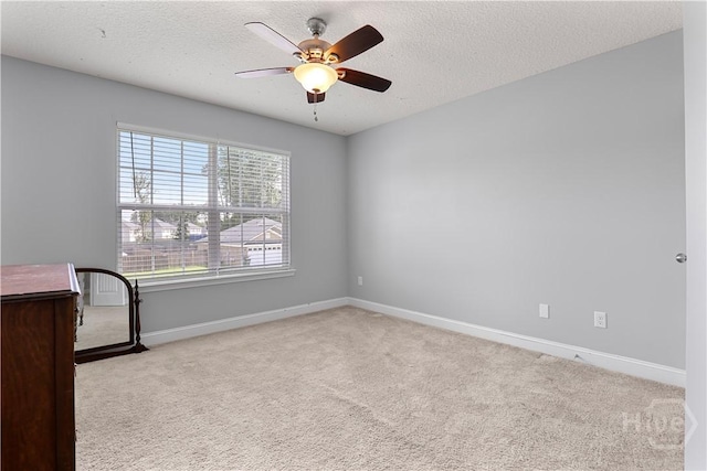 42 Kinlock Ct, Midway, GA 31320 - carpeted spare room with ceiling fan, baseboards, and a textured ceiling