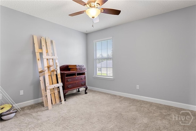 42 Kinlock Ct, Midway, GA 31320 - living area featuring carpet, baseboards, ceiling fan, and a textured ceiling