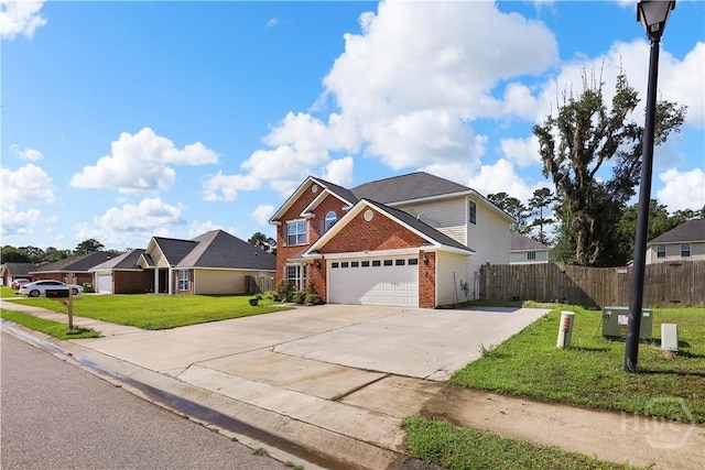 42 Kinlock Ct, Midway, GA 31320 - traditional-style home featuring brick siding, a garage, and concrete driveway