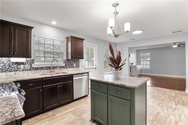 42 Kinlock Ct, Midway, GA 31320 - kitchen featuring stainless steel appliances, a sink, backsplash, a textured ceiling, and a ceiling fan