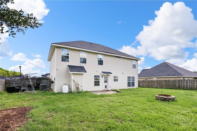 42 Kinlock Ct, Midway, GA 31320 - back of house with an outdoor fire pit and cooling unit