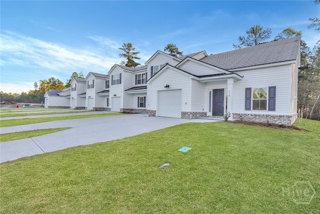 238 Haisley Run, Guyton, GA 31312 - view of front facade with driveway, a front yard, and an attached garage