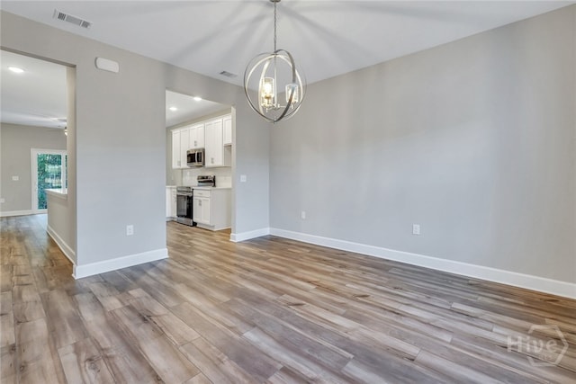 238 Haisley Run, Guyton, GA 31312 - unfurnished living room featuring a chandelier, light wood-type flooring, recessed lighting, and baseboards