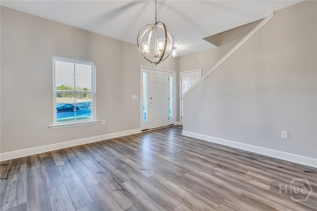 238 Haisley Run, Guyton, GA 31312 - foyer entrance featuring a chandelier, wood finished floors, and baseboards