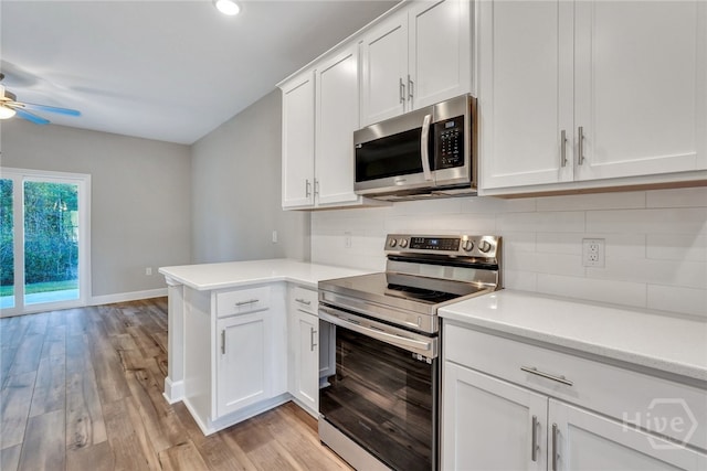 238 Haisley Run, Guyton, GA 31312 - kitchen featuring appliances with stainless steel finishes, a ceiling fan, decorative backsplash, light countertops, and light wood-style floors