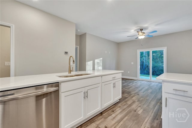 238 Haisley Run, Guyton, GA 31312 - kitchen with dishwasher, a sink, ceiling fan, light wood-style flooring, and white cabinets