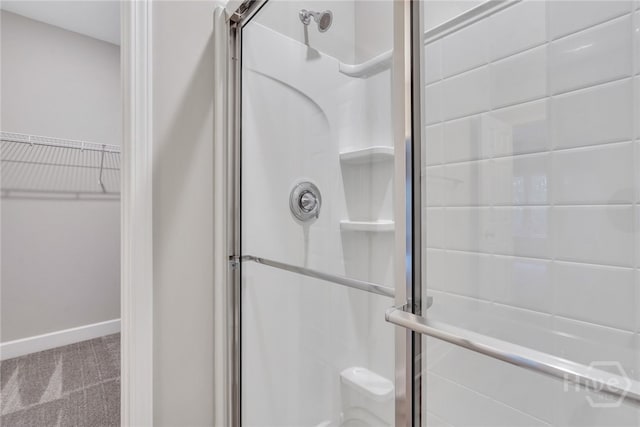 238 Haisley Run, Guyton, GA 31312 - full bathroom featuring a stall shower, baseboards, and a spacious closet