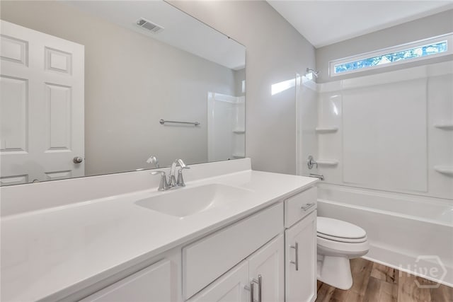 238 Haisley Run, Guyton, GA 31312 - bathroom featuring vanity, toilet, wood finished floors, and tub / shower combination