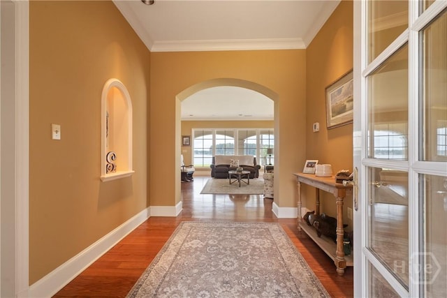 745 S Chickasaw Trl, Sparta, GA 31087 - hallway with arched walkways, wood finished floors, baseboards, and ornamental molding
