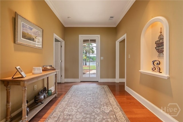 745 S Chickasaw Trl, Sparta, GA 31087 - doorway featuring wood finished floors, crown molding, and baseboards
