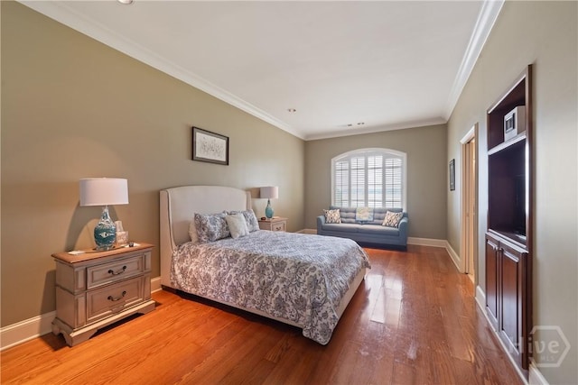 745 S Chickasaw Trl, Sparta, GA 31087 - bedroom featuring light wood finished floors, ornamental molding, and baseboards