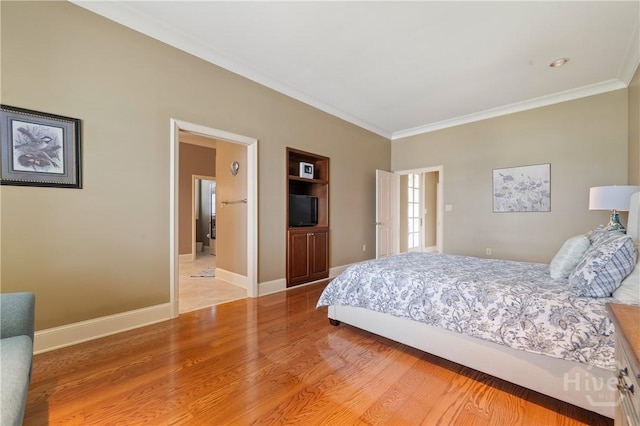745 S Chickasaw Trl, Sparta, GA 31087 - bedroom with ornamental molding, light wood finished floors, and baseboards