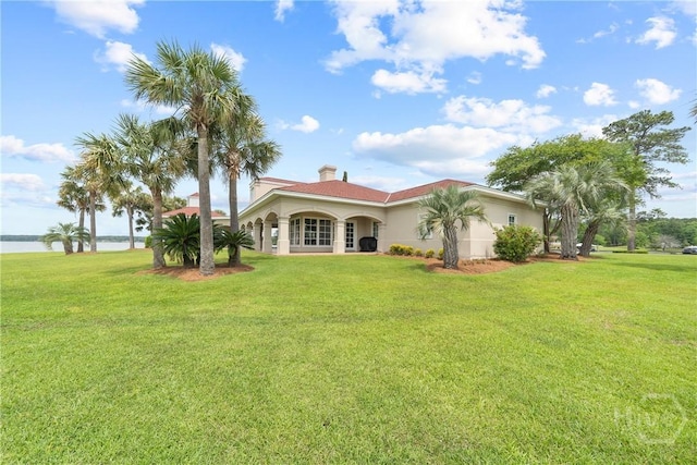 745 S Chickasaw Trl, Sparta, GA 31087 - back of house with a yard, a water view, and stucco siding