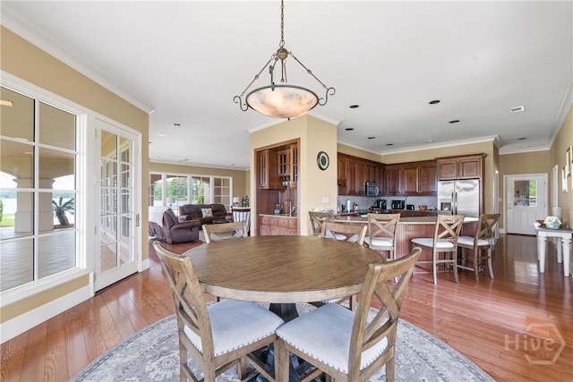 745 S Chickasaw Trl, Sparta, GA 31087 - dining room with light wood finished floors, ornamental molding, baseboards, and recessed lighting