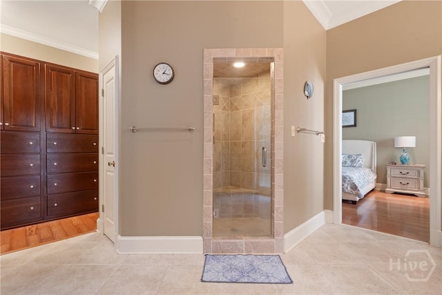 745 S Chickasaw Trl, Sparta, GA 31087 - ensuite bathroom featuring ornamental molding, a shower stall, tile patterned floors, and baseboards