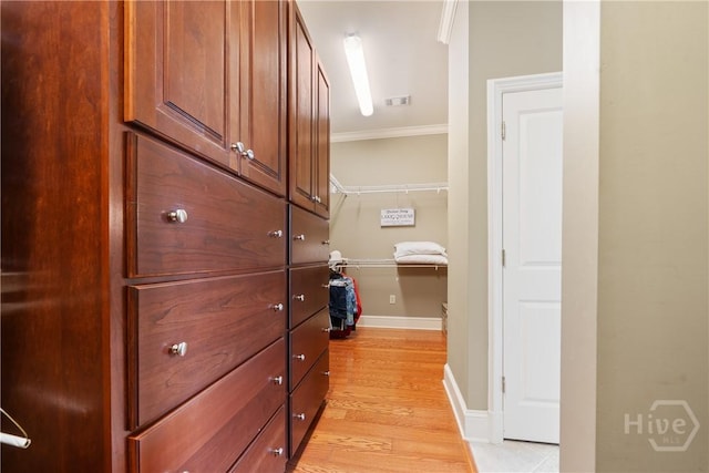 745 S Chickasaw Trl, Sparta, GA 31087 - hall with crown molding, light wood-style floors, and baseboards