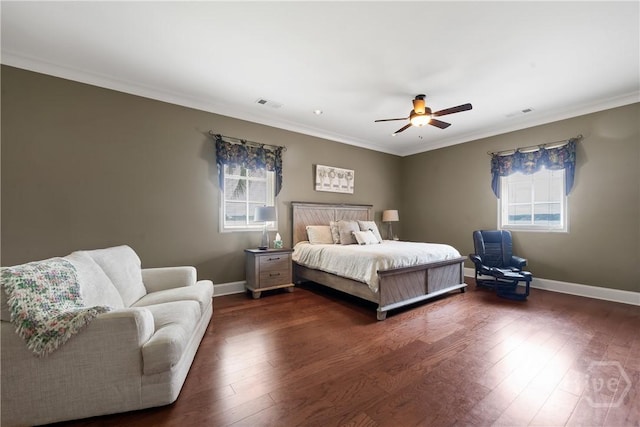745 S Chickasaw Trl, Sparta, GA 31087 - bedroom featuring multiple windows, dark wood-style flooring, crown molding, and baseboards