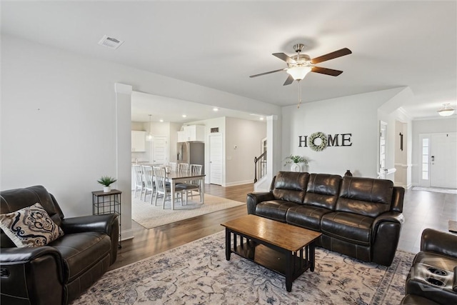 109 Finch Ln, Guyton, GA 31312 - living room featuring a ceiling fan, wood finished floors, baseboards, stairway, and recessed lighting