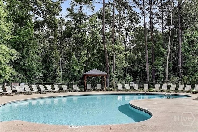 60 Kepler Loop, Richmond Hill, GA 31324 - community pool with a gazebo and a patio area