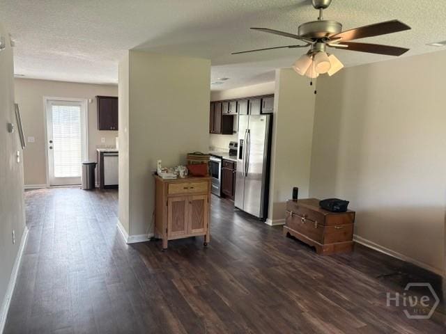 101 Rebel Estates Dr, Springfield, GA 31329 - kitchen featuring stainless steel appliances, dark wood-type flooring, a ceiling fan, baseboards, and light countertops