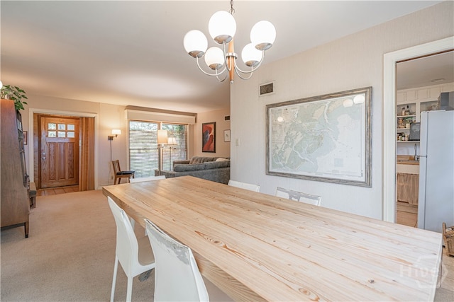 119 Dyches Dr, Savannah, GA 31406 - carpeted dining room with a chandelier