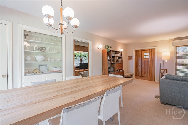 119 Dyches Dr, Savannah, GA 31406 - dining area with a chandelier and carpet flooring