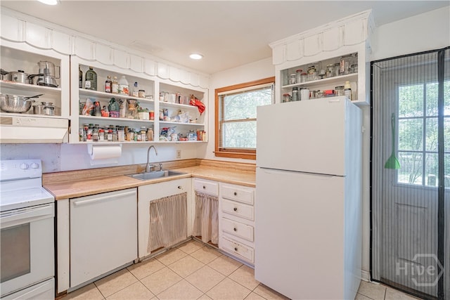 119 Dyches Dr, Savannah, GA 31406 - kitchen featuring white appliances, open shelves, a sink, under cabinet range hood, and light tile patterned floors
