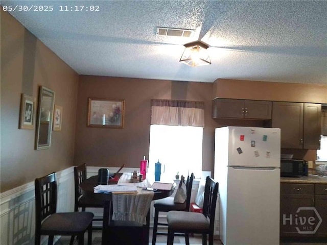 41 Crosby Dr, Hinesville, GA 31313 - dining space with a textured ceiling and healthy amount of natural light