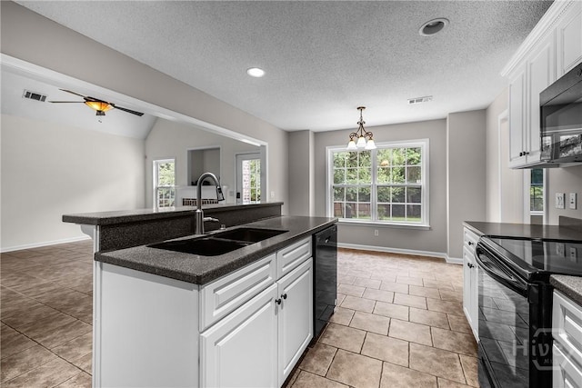 172 Jamestown Dr, Rincon, GA 31326 - kitchen with a sink, black appliances, dark countertops, a center island with sink, and baseboards