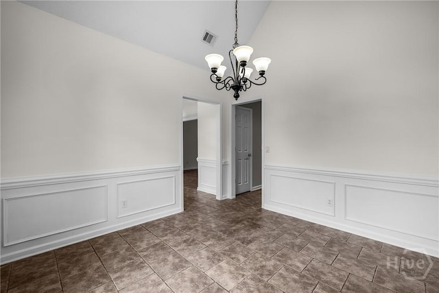 172 Jamestown Dr, Rincon, GA 31326 - unfurnished dining area with a chandelier, high vaulted ceiling, a decorative wall, and a wainscoted wall