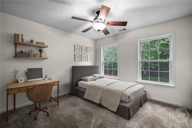 172 Jamestown Dr, Rincon, GA 31326 - bedroom with carpet, baseboards, ceiling fan, and a textured ceiling