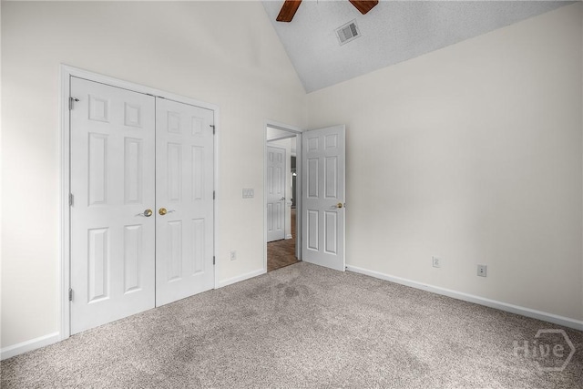 172 Jamestown Dr, Rincon, GA 31326 - unfurnished bedroom with carpet floors, vaulted ceiling, a closet, baseboards, and ceiling fan