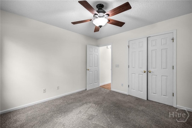 172 Jamestown Dr, Rincon, GA 31326 - unfurnished bedroom with carpet flooring, baseboards, a closet, ceiling fan, and a textured ceiling