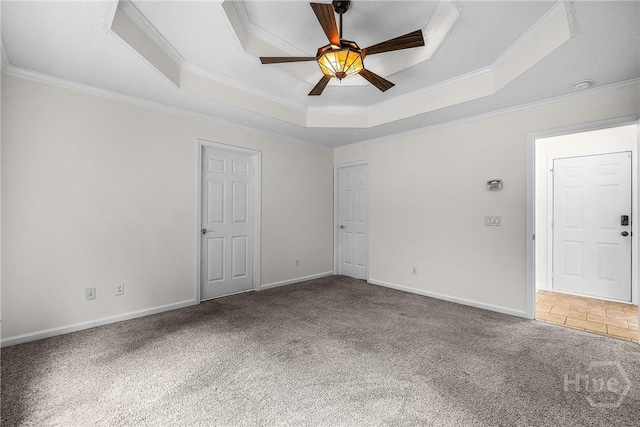 172 Jamestown Dr, Rincon, GA 31326 - carpeted spare room with a tray ceiling, ornamental molding, a ceiling fan, baseboards, and a smoke detector