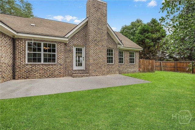 172 Jamestown Dr, Rincon, GA 31326 - back of property with a chimney, brick siding, and roof with shingles
