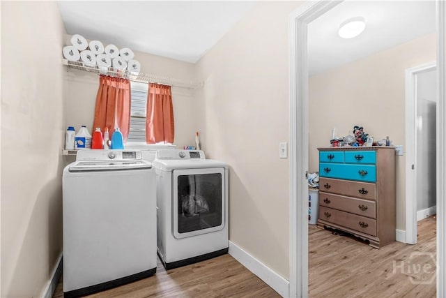 135 Verde Bnd, Savannah, GA 31419 - laundry area with washing machine and clothes dryer, light wood-style floors, and baseboards