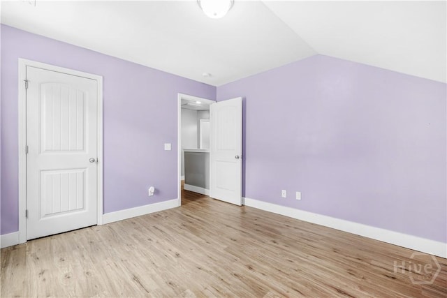 135 Verde Bnd, Savannah, GA 31419 - unfurnished bedroom with baseboards, wood finished floors, and vaulted ceiling