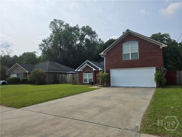 182 Gloucester Dr, Midway, GA 31320 - traditional-style home featuring concrete driveway, a garage, and brick siding