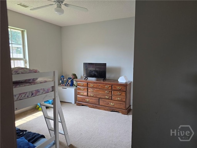 182 Gloucester Dr, Midway, GA 31320 - carpeted bedroom with a ceiling fan and a textured ceiling