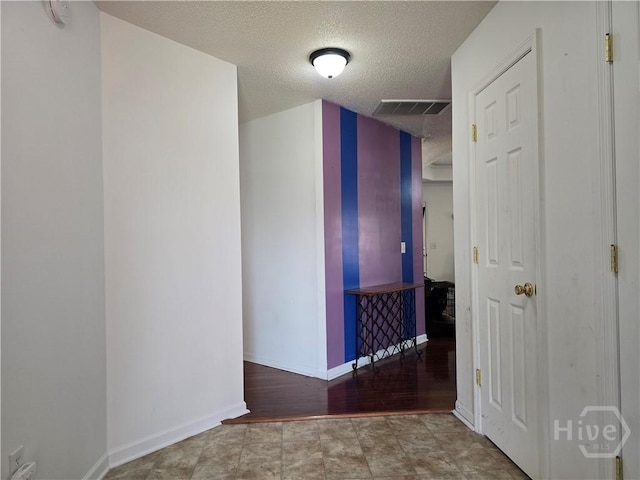 182 Gloucester Dr, Midway, GA 31320 - hallway with a textured ceiling and baseboards