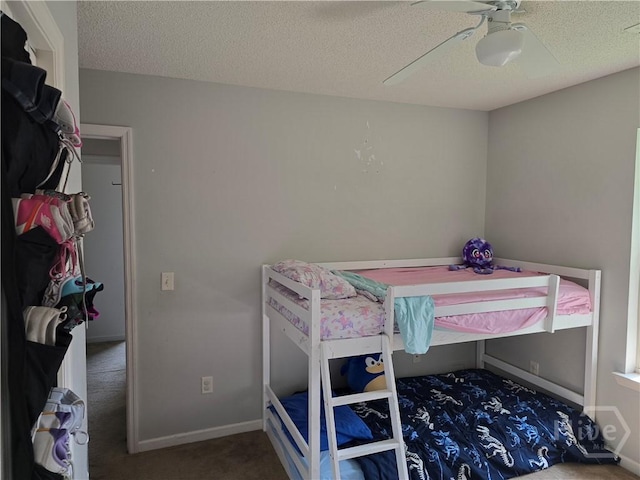 182 Gloucester Dr, Midway, GA 31320 - carpeted bedroom with a textured ceiling, ceiling fan, and baseboards
