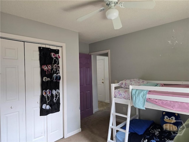 182 Gloucester Dr, Midway, GA 31320 - carpeted bedroom with baseboards, a closet, and a ceiling fan