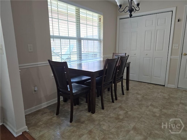 182 Gloucester Dr, Midway, GA 31320 - dining area with a chandelier and baseboards