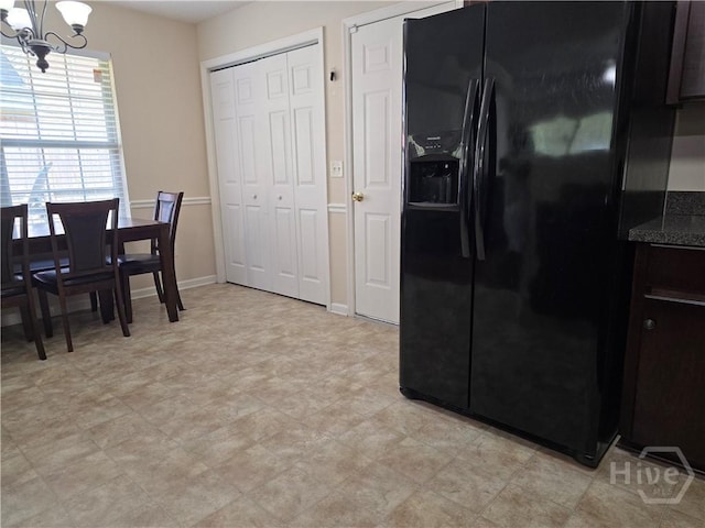 182 Gloucester Dr, Midway, GA 31320 - dining space with a chandelier