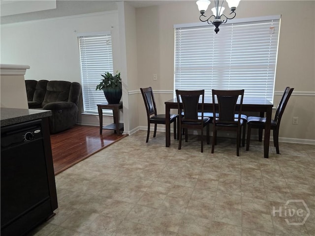 182 Gloucester Dr, Midway, GA 31320 - dining space with baseboards and a chandelier